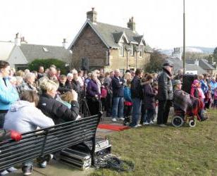Crowd at the unveiling of the Juniper Green monument